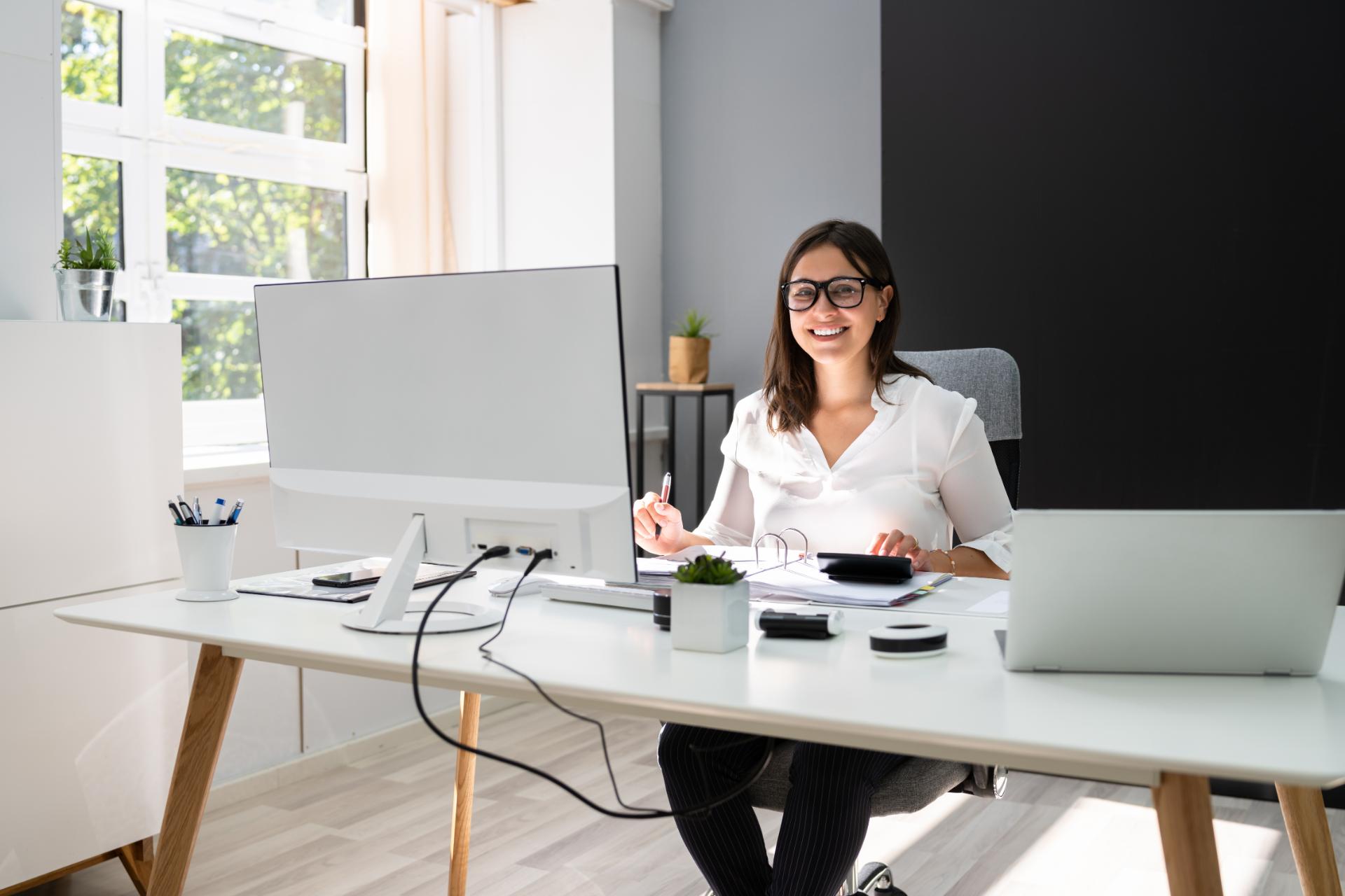 Girl working on laptop in office